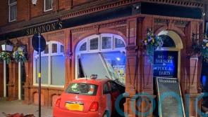 Two taken to hospital after car crashes into pub