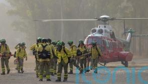 Spain evacuates 2,000 people as crews race to check wildfire