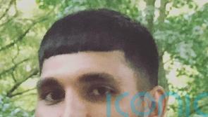 Three charged with murdering father found dead in woodland