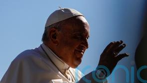 Pope bows out of annual procession due to knee pain