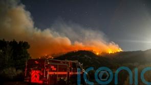 Wildfires force evacuations in Arizona and California