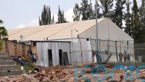 What happens when the first migrants arrive in the Rwanda from the UK?