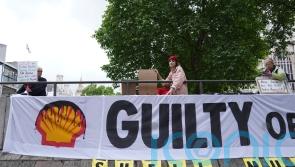 Shell forced to pause shareholder meeting amid climate protest