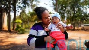 Residents at Rwandan refugee camp seek safety and a future for their children