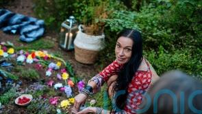 Single mother who lived off-grid in a caravan with her kids making £60 a week teaching mums to forage is now £120K self-sufficiency coach
