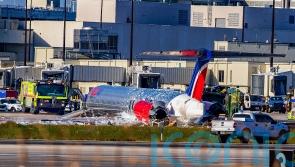 Three hurt as jet crash lands and catches fire in Miami