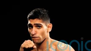 Three men charged after boxer Amir Khan ‘robbed at gunpoint’