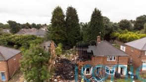 Woman dead and man fighting for life as locals describe heroic house rescue