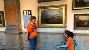 Climate protesters glue themselves to frame of artwork at Kelvingrove museum