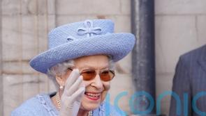 Smiling Queen takes part in third event during royal week in Scotland