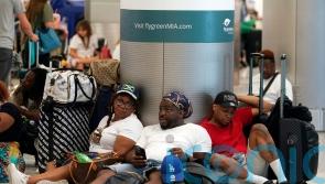 Holiday getaway pushes US airport traffic to pandemic high