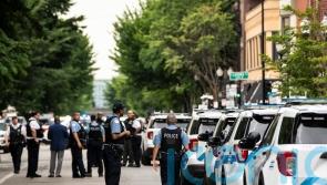 Gunman kills two people and wounds three police officers in shootout