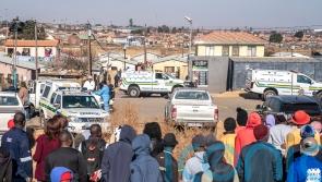 South Africa shocked by bar shootings that killed 21 as police hunt suspects