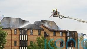 Woman who died after explosion at Bedford flats named by police