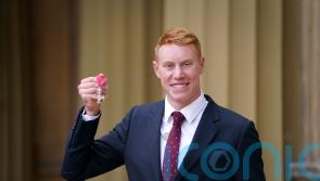 I’ve had worse Thursdays, jokes Olympic swimmer Tom Dean as he collects MBE