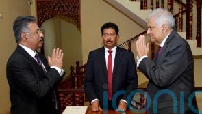 Sri Lanka’s PM sworn in as interim president after Rajapaksa resigns