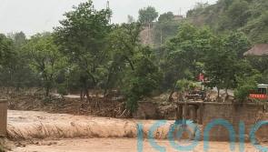 At least 12 dead as thousands evacuated amid flash floods in China