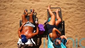 Wales ‘records hottest day on record’ as temperatures hit 37.1C