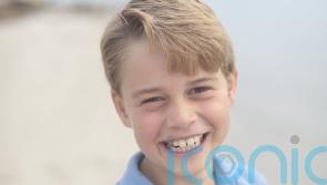 Beaming Prince George photographed by Kate for his official birthday picture