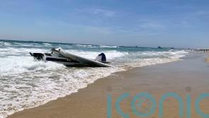 Trainee lifeguards put to test as plane crashes into sea during competition