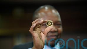 Zimbabwe debuts gold coins as legal tender to stem inflation