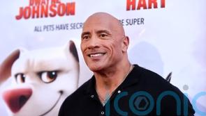 Dwayne Johnson surprises family of fans with new puppy at Super-Pets screening