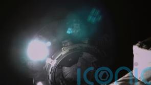 Chinese spacecraft returns amid booster rocket concerns