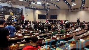 Demonstrators enter Iraqi parliament in protest over selection of nominee for PM