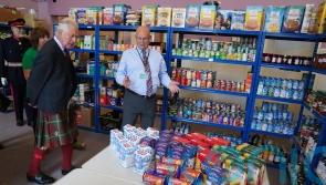 Charles makes donation while visiting Wick-based food bank