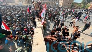 Cleric’s followers force way into Iraqi parliament for second time this week