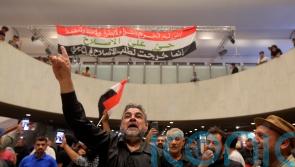 Iraqi protesters camp out in parliament for second day