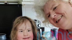 Loving mum of Down’s girl left with PTSD after treatment for everything from a heart defect to leukaemia praises charity for making her smile