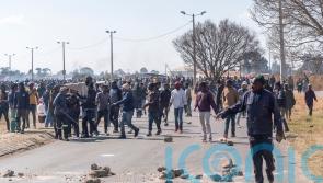Clashes in South Africa as illegal miners targeted after alleged gang rapes