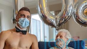 Flirty great grandmother is served glass of bubbly on her 106th birthday by naked butler and she is taken by his “impressive” hairless chest