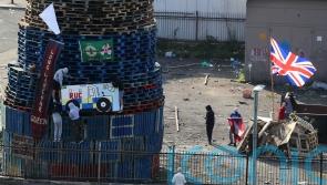 Placing of flags and images on nationalist bonfire condemned
