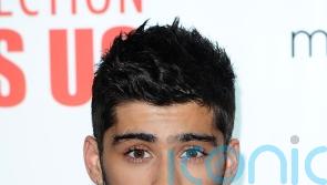 Fans speculate after Zayn Malik sings another One Direction tune