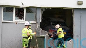 Driver arrested after car crashes through wall of Paisley flats