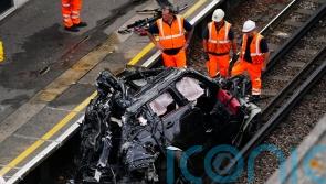 Woman dies in crash that leaves Range Rover on railway track