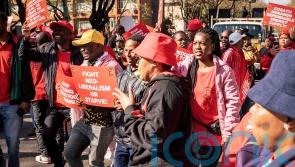 South African workers march in capital against inflation