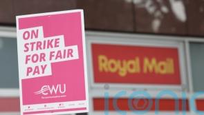 Postal workers strike for second day in fight for improved pay