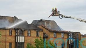 Woman who died after explosion at flats started fire herself, say police