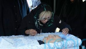 Gorbachev buried in Moscow as Putin snubs ceremony
