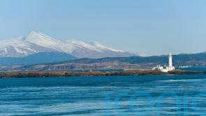 Two rescued from life raft after abandoning sinking boat