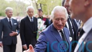 King and Queen shake hands with well-wishers at Clarence House