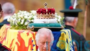 Queen’s children mount vigil around their mother’s coffin in tribute