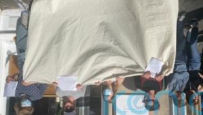 Activists gather with ‘blank canvas’ to protest against anti-monarchy arrests