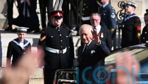Thousands line streets of Belfast to catch glimpse of the King and Queen Consort