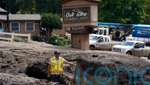 Clean-up begins after mudslides sweep through California mountain communities