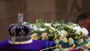 Imperial State Crown and Balmoral and Windsor flowers placed on Queen’s coffin