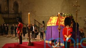 Royal guard collapses next to Queen’s coffin on first night of lying in state
